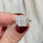 Three Stone Radiant Engagement Ring With Basket Setting And Trapezoid Side Stones