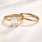 Four claw prong emerald cut solitaire engagement ring
