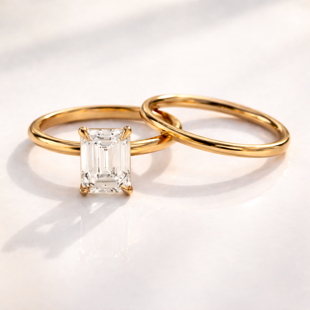 Four claw prong emerald cut solitaire engagement ring
