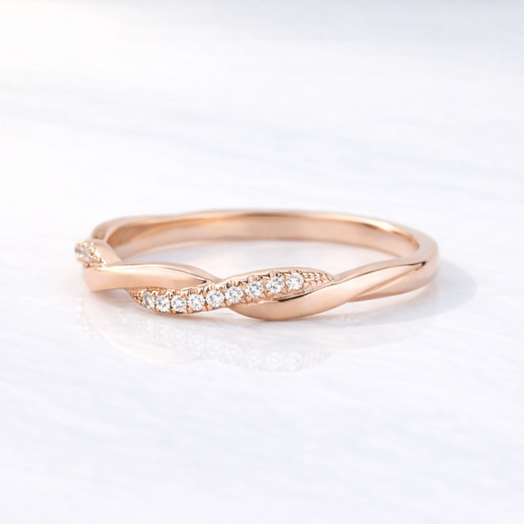 Elegant Infinity Wedding Band With Twisted Rose Gold Design
