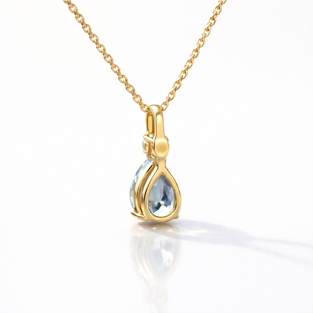 Aquamarine Pendant With Pear-Shaped Gemstone And Round Diamond Accent.
