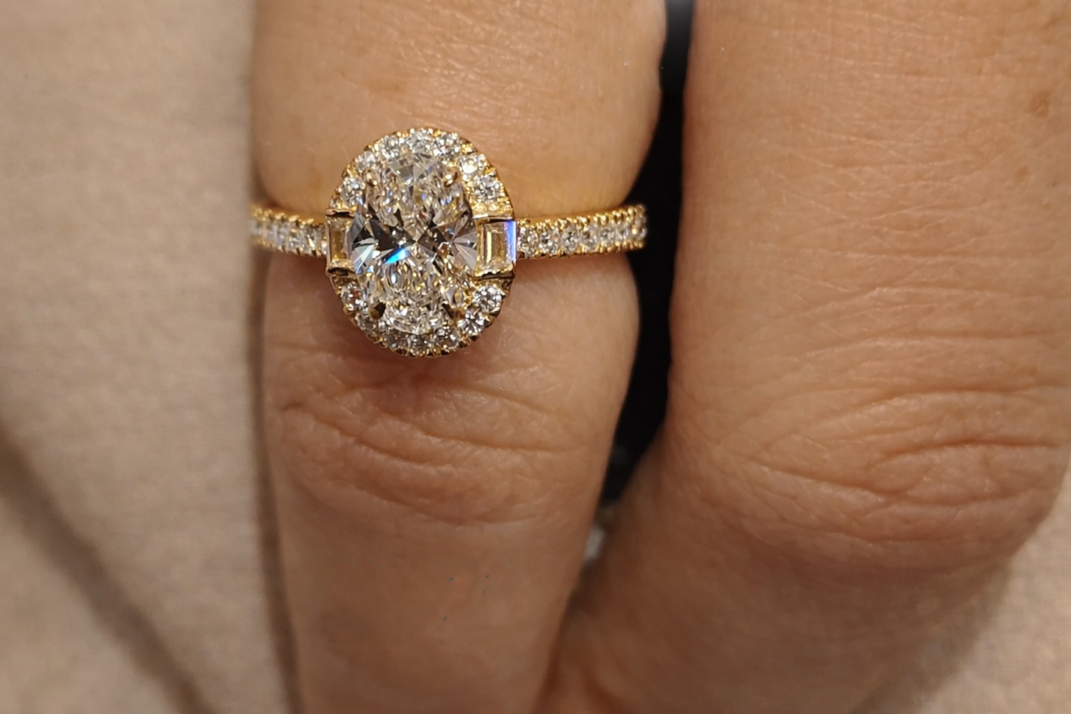 Oval Halo Ring Featuring Bridge Accent Ring And 4 Claw Prong Setting
