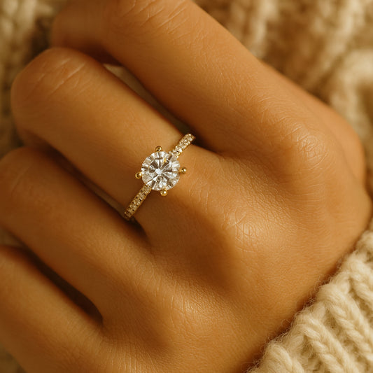 Round Brilliant Moissanite Solitaire Engagement Ring In Yellow Gold Pave Band, Radiating Diamond-Like Brilliance.