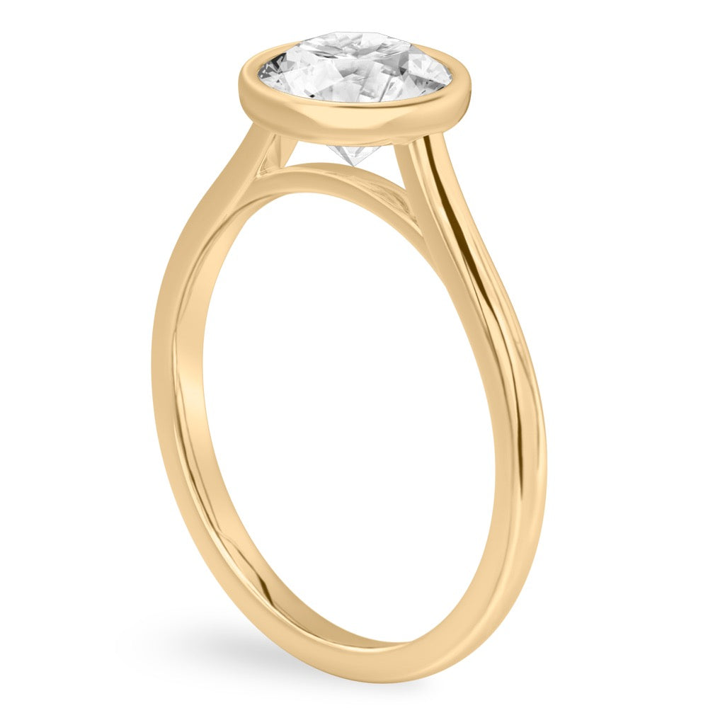 Sophisticated Bezel Diamond Ring Showcasing A Brilliant Round Stone In Gold.
