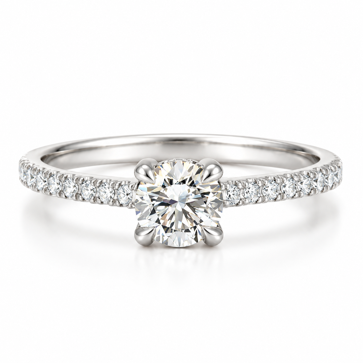 Polished silver solitaire diamond engagement ring with round brilliant center stone, four prong setting, and pavé diamond accent band