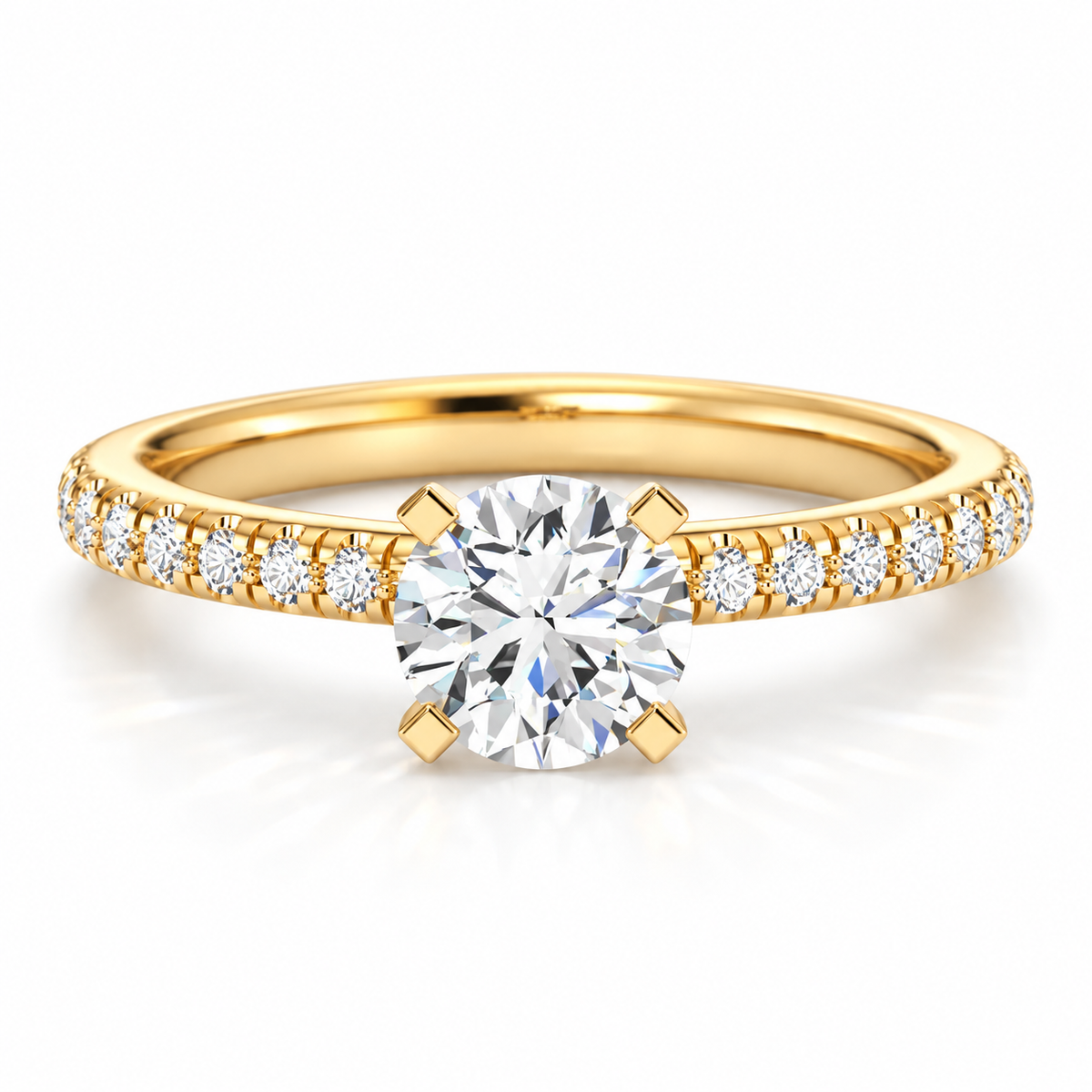 Round brilliant cut diamond engagement ring in polished yellow gold with a pavé diamond band and four-prong solitaire setting.