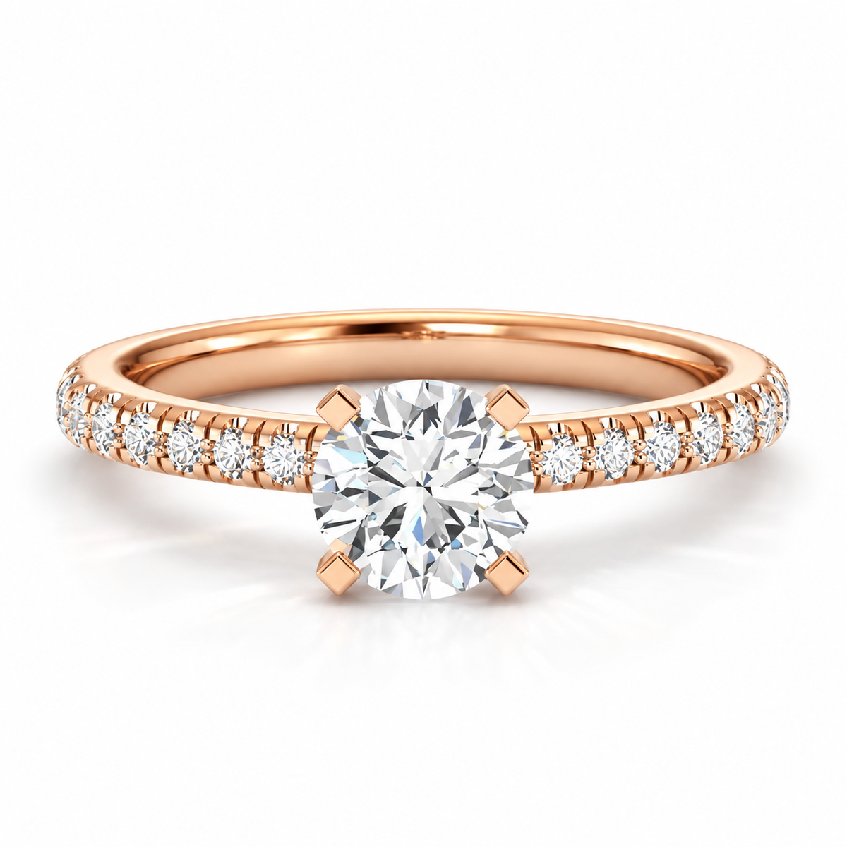 Round brilliant cut diamond engagement ring in 18K rose gold vermeil with a pavé diamond band and four-prong solitaire setting.