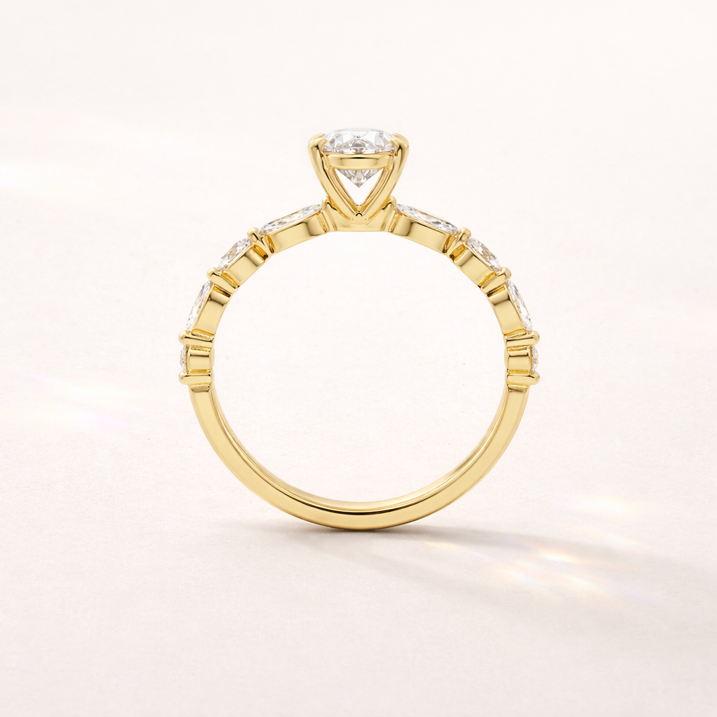 Elegant Oval Engagement Ring With Marquise Side Stones And Gold Band
