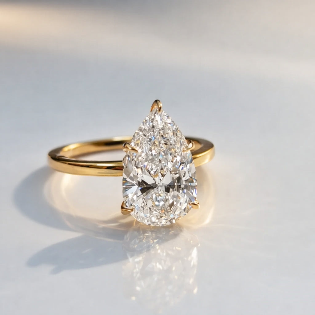 Pear Shape Diamond Ring With Six Claw Prong Setting In Yellow Gold