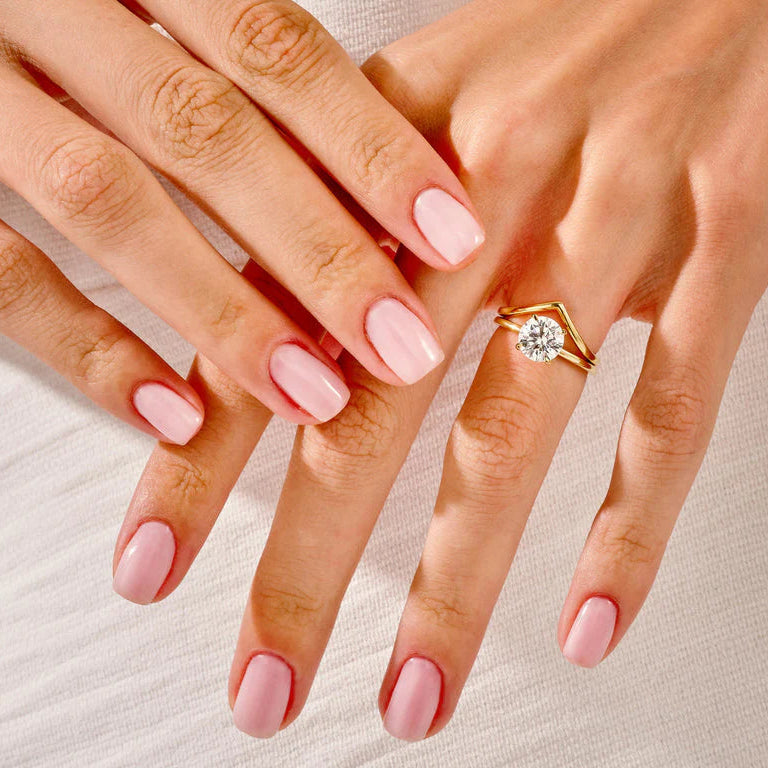 Round diamond solitaire ring with V curved band
