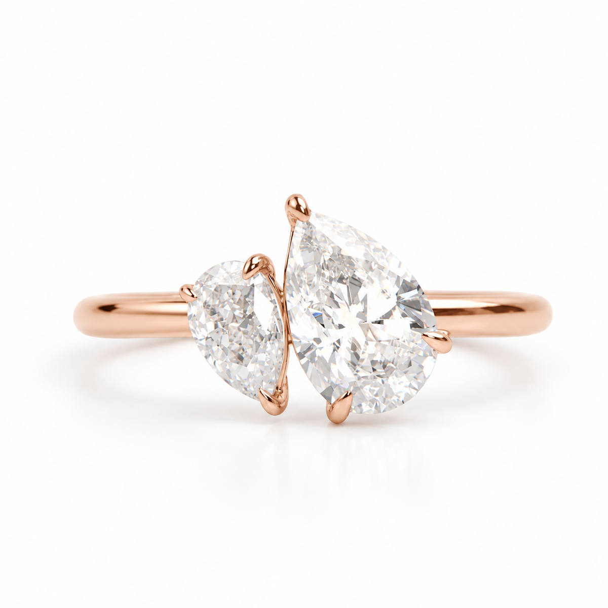 “Ultra-realistic 18K rose gold toi et moi ring featuring two pear-shaped diamonds on a clean white background.”