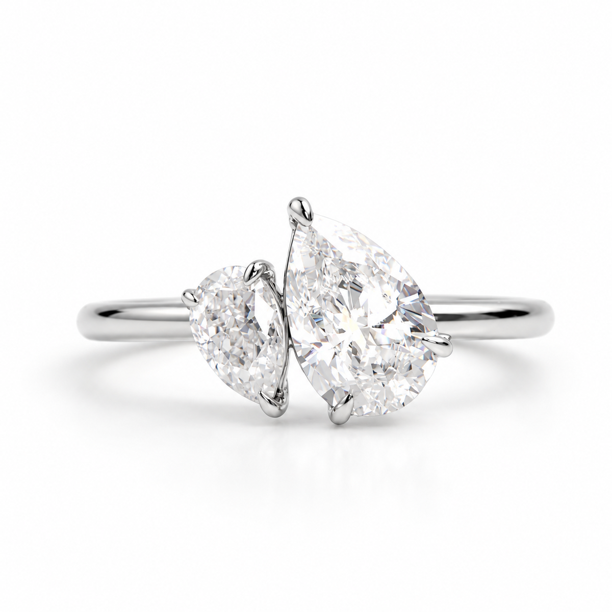 Ultra-realistic polished silver toi et moi ring featuring two pear-shaped diamonds on a clean white background