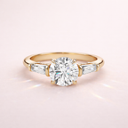 Three Stone Diamond Engagement Ring With Round Center And Tapered Baguette Side Stones
