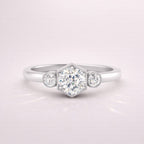 Milgrain Engagement Ring With Round Cut Three Stone Design In White Gold
