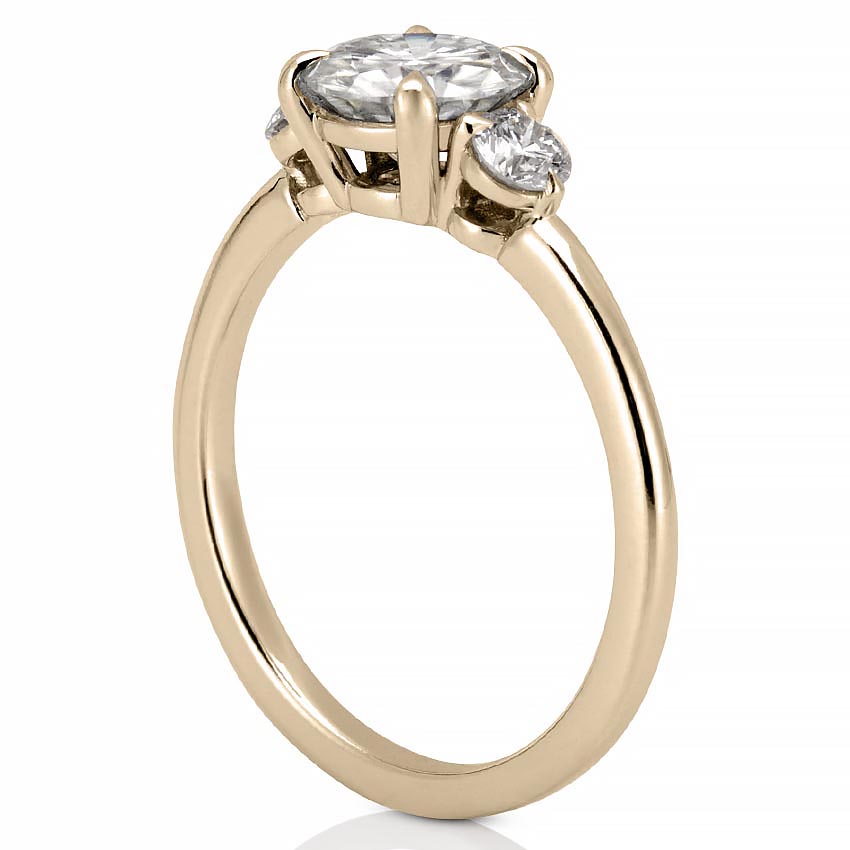 Round Cut Diamond Ring With A Tapered Band And Secure Prongs.
