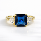Three Stone Sapphire Ring Princess Cut Engagement Ring Trillion Side Stones.
