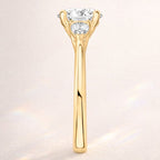 Round Cut Center Stone Set In A Tapered Yellow Gold Band.
