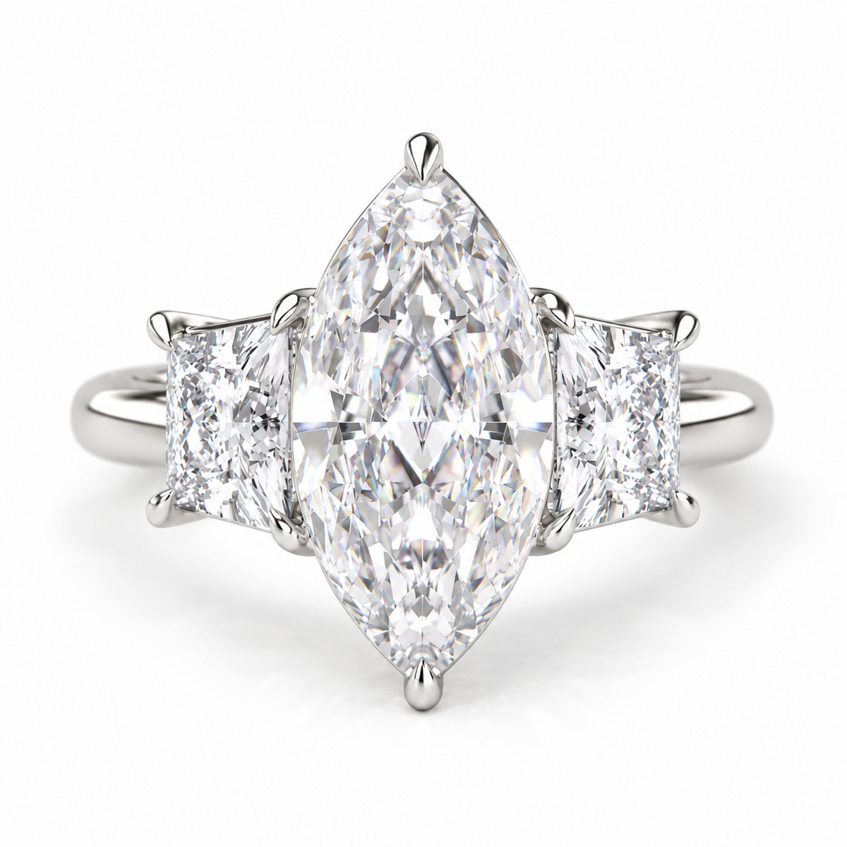 Marquise cut diamond three-stone engagement ring in polished silver with two rectangular side diamonds and a classic prong setting.