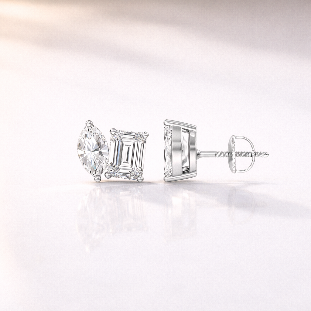 Two Stone Earrings With Marquise And Emerald Cut Diamonds In Gold Prong Setting
