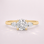 Gold Trellis Ring With Interwoven Prongs And A Polished Metal Band.
