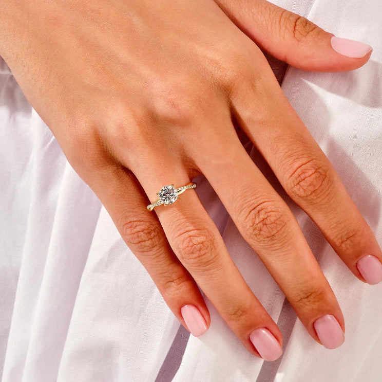 Rose gold twisted engagement ring with wedding band
