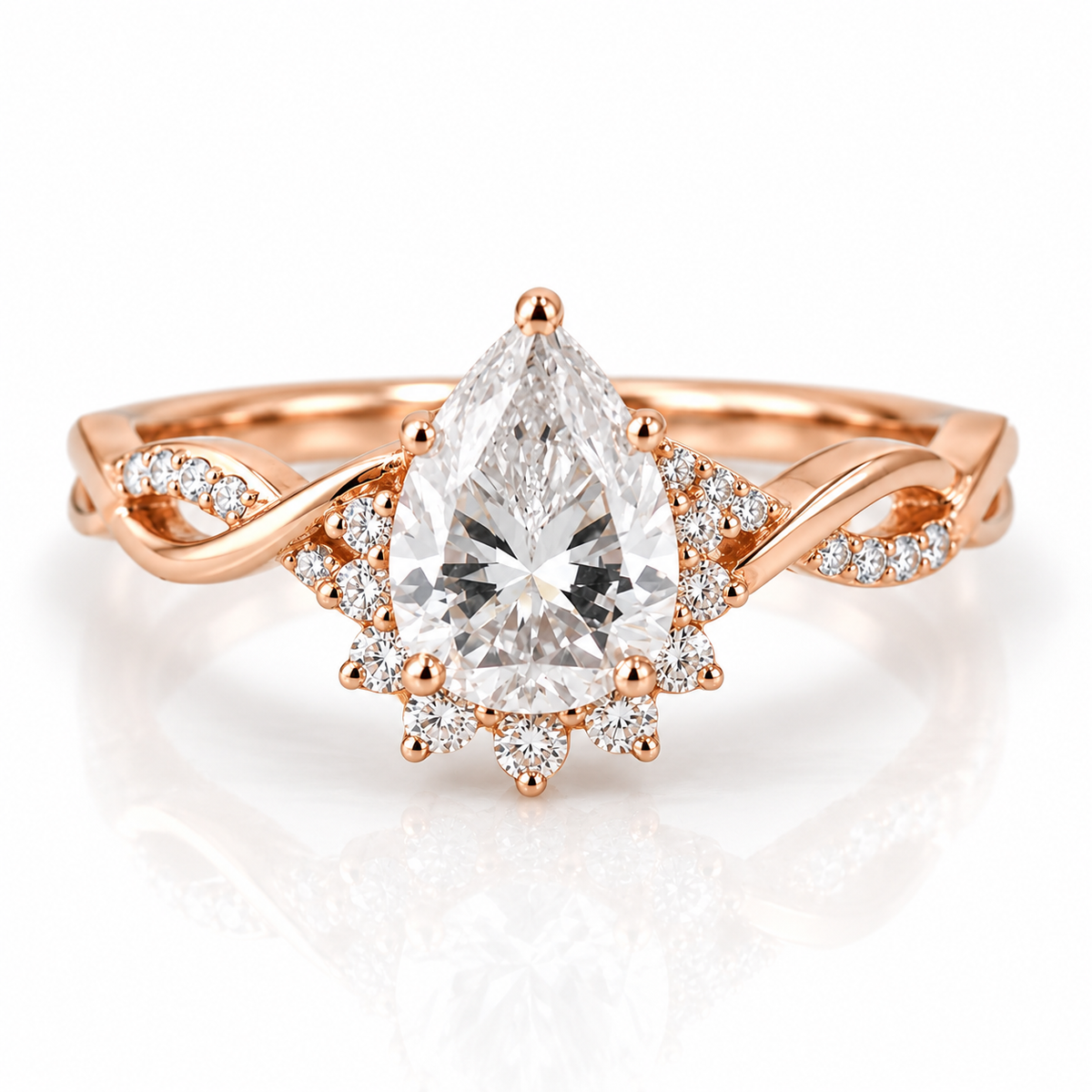 18K rose gold pear-shaped engagement ring with sparkling halo, pavé diamond accents, and twisted band design