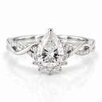 Polished silver pear-shaped engagement ring with sparkling halo, pavé diamond accents, and twisted band design