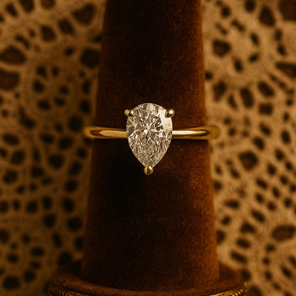 Elegant Pear Cut Moissanite Solitaire Ring In Gold, A Sparkling Diamond Alternative Wedding Ring Perfect For Her.