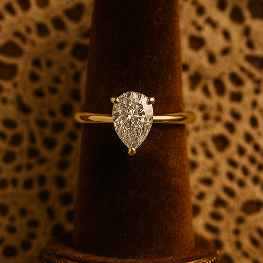 Elegant Pear Cut Moissanite Solitaire Ring In Gold, A Sparkling Diamond Alternative Wedding Ring Perfect For Her.