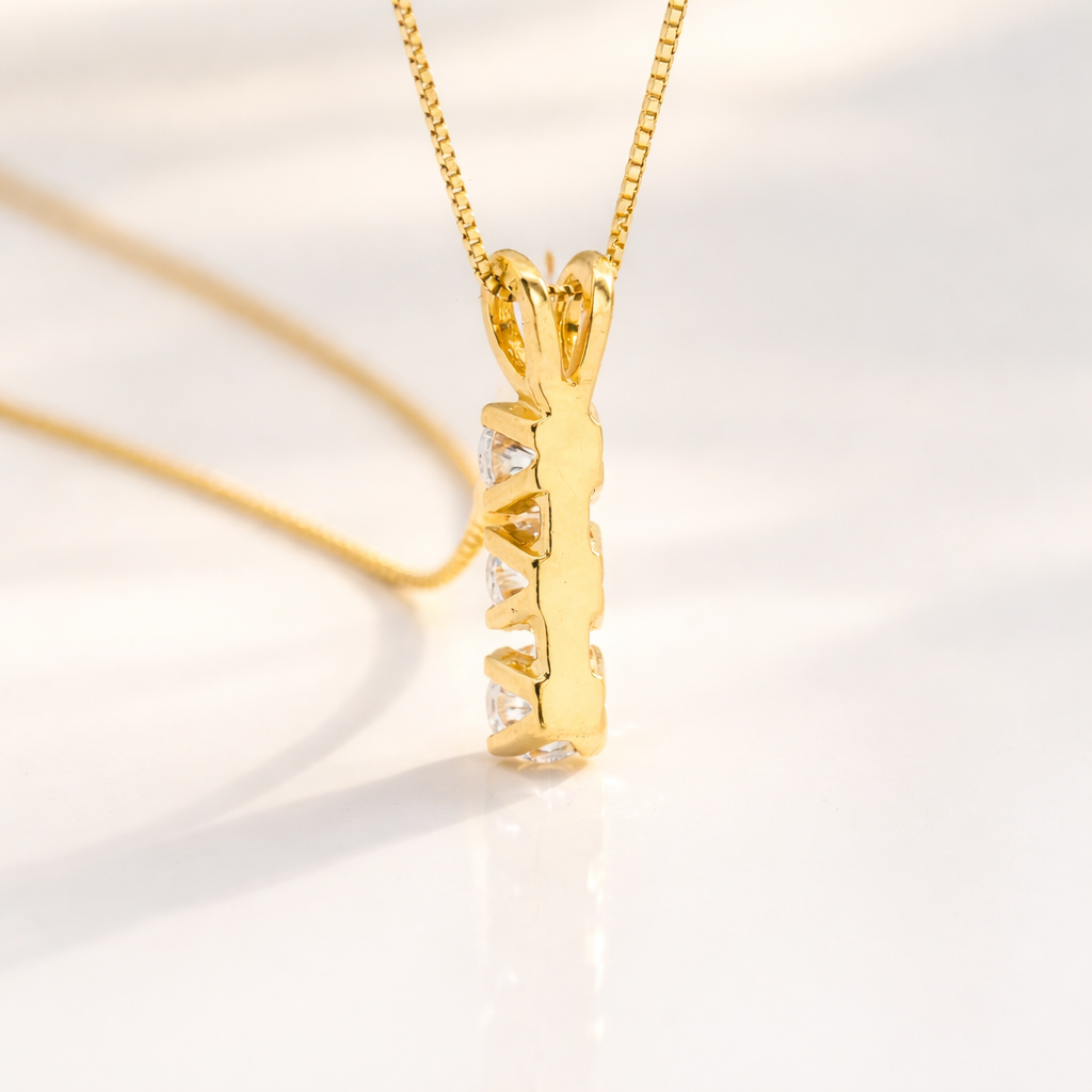 Trilogy Diamond Pendant In Gold, Featuring Three Round Diamonds.
