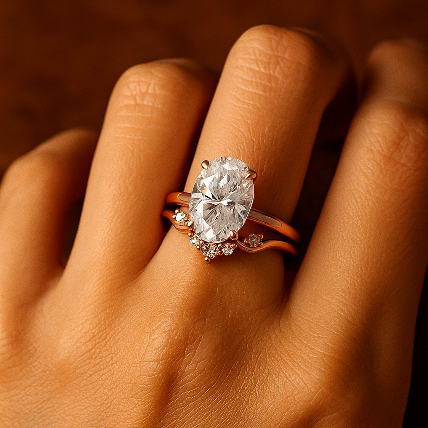 Detailed Close-Up Of Oval Moissanite Ring With Sparkling Accents And Rose Gold Setting