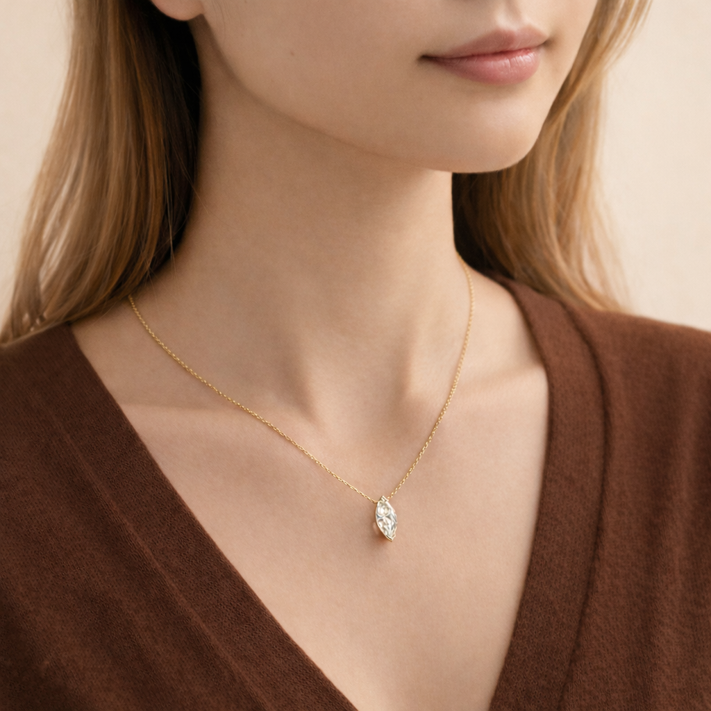 Elegant Gold Cross Pendant With Round Diamond In A 4-Prong Setting.
