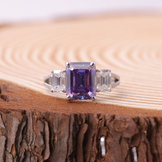 Amethyst is the birthstone for February Wedding Rings or Symbolism Peace & Spiritual Protection Promise Rings  Ring with a purple gemstone on a wooden surface