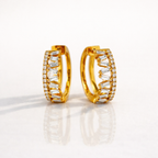 Gold Hoop Earrings With Baguette And Round Diamond Design
