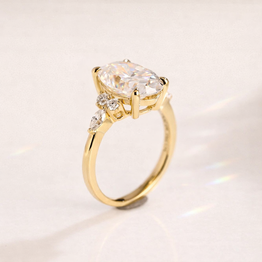 Yellow Gold Oval Moissanite Ring With Side Stone Detailing

