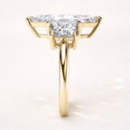 Moissanite Engagement Ring Featuring Three Round Cut Stones And Milgrain Detail
