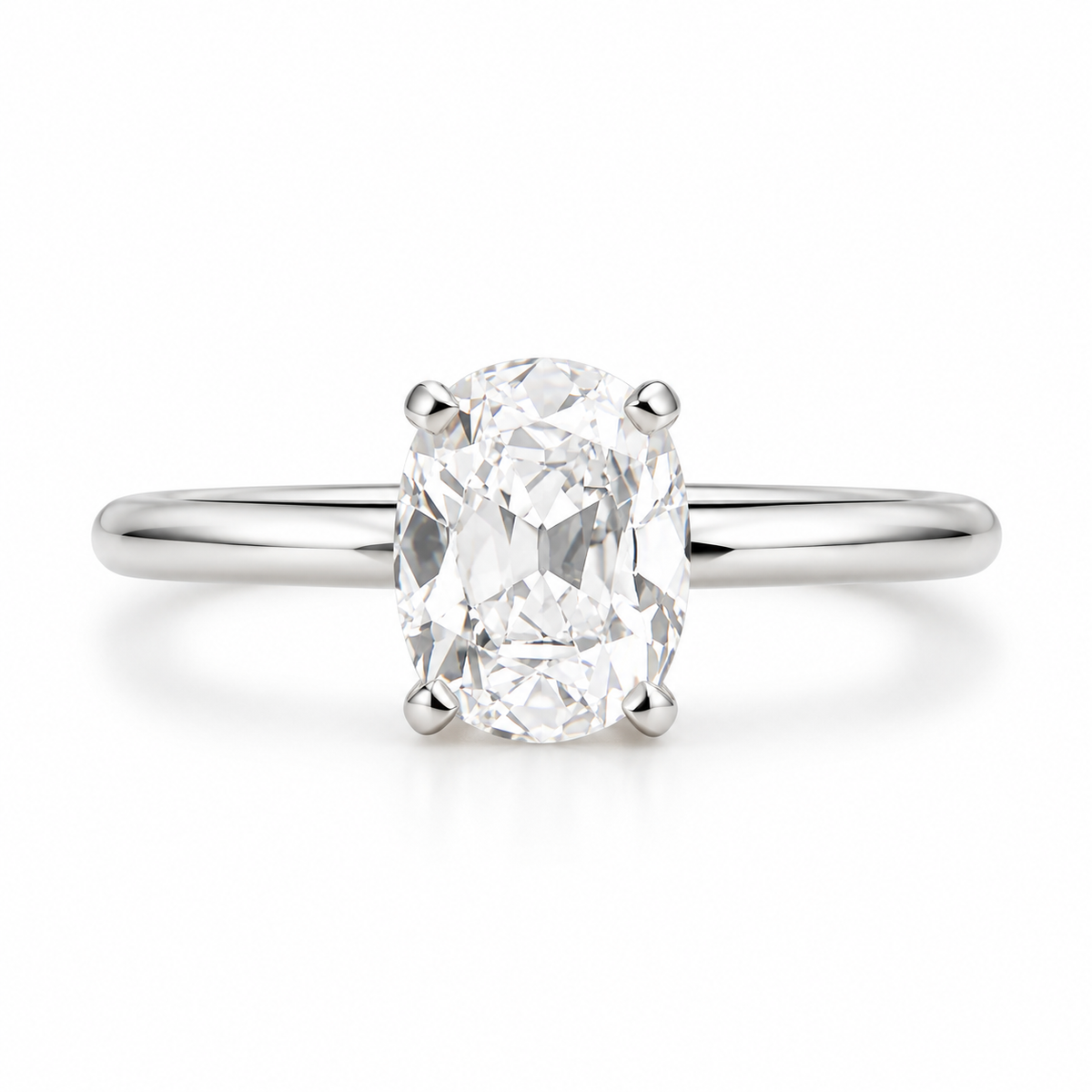 Elegant oval cut moissanite engagement ring in high-quality polished silver with a classic four prong setting and sleek solitaire band.