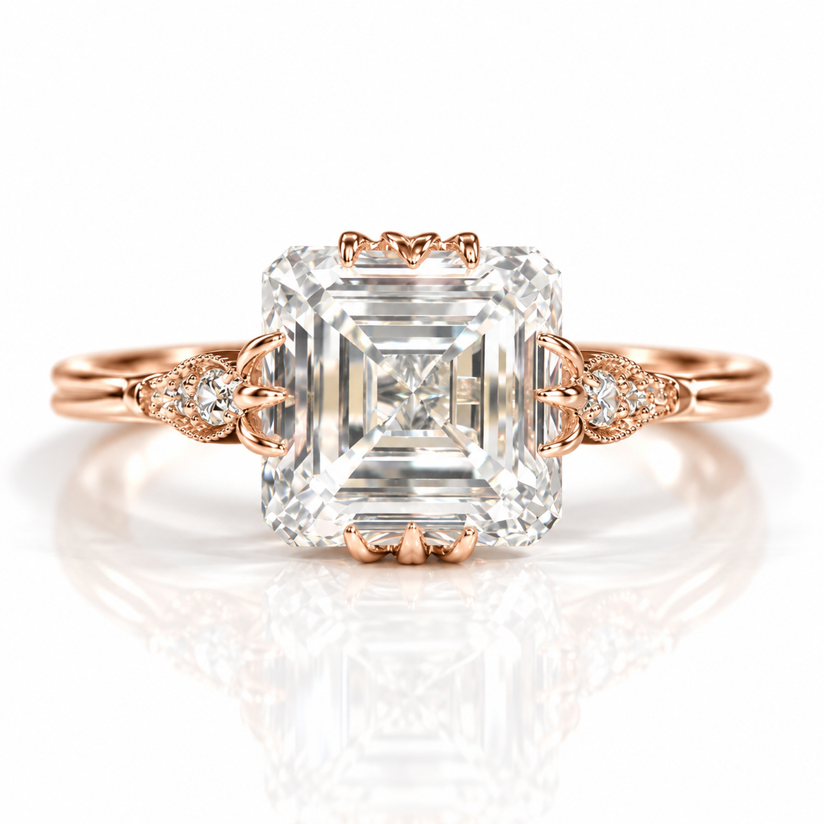 18K rose gold vermeil Asscher-cut engagement ring with vintage leaf-inspired side details and accent diamonds.
s