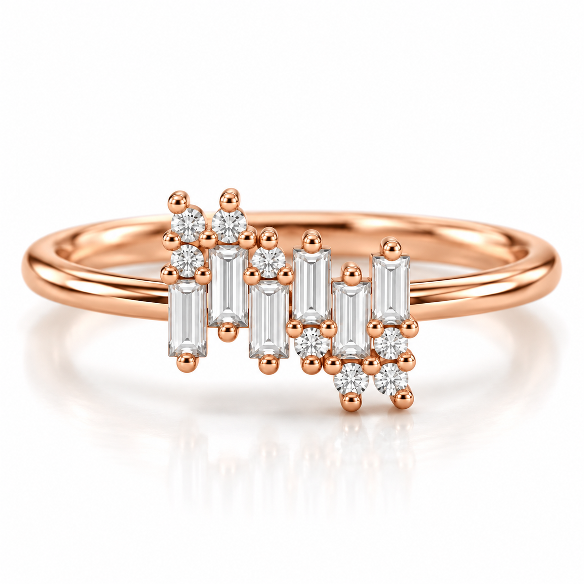18K rose gold vermeil ring with an asymmetrical cluster of baguette and round-cut stones on a polished band, photographed on a white background.