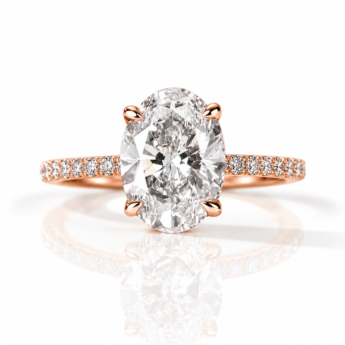 18K rose gold vermeil oval-cut diamond engagement ring with pavé diamond band on a white background.