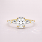 Oval Side Stone Engagement Ring With Round And Marquise Cut Diamonds In Yellow Gold
