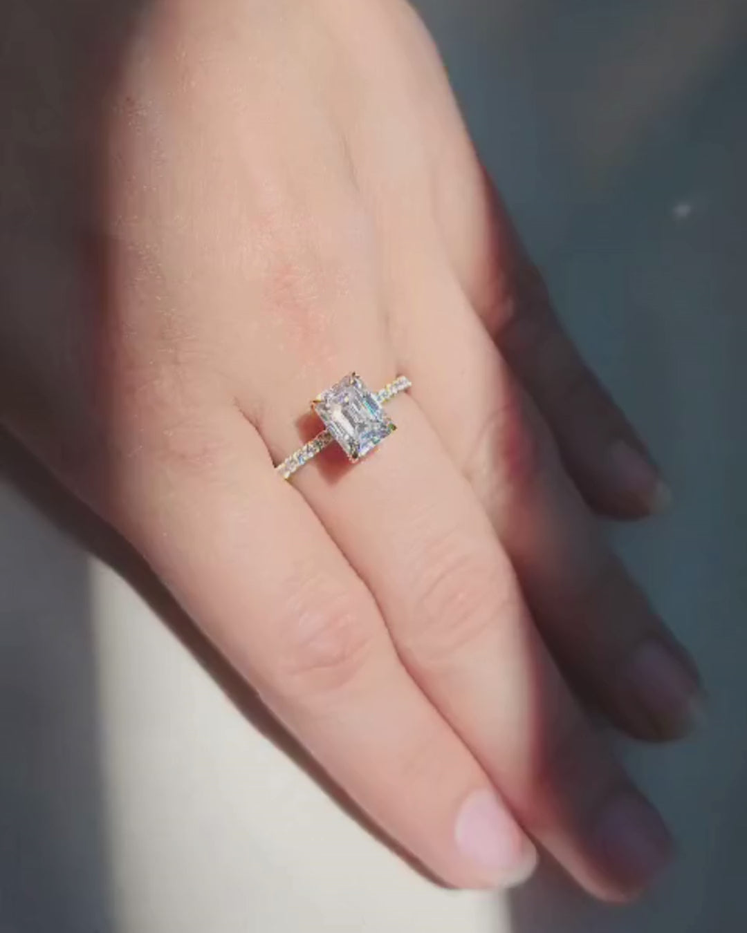 Hidden Halo Emerald Cut Engagement Ring with Pave Band