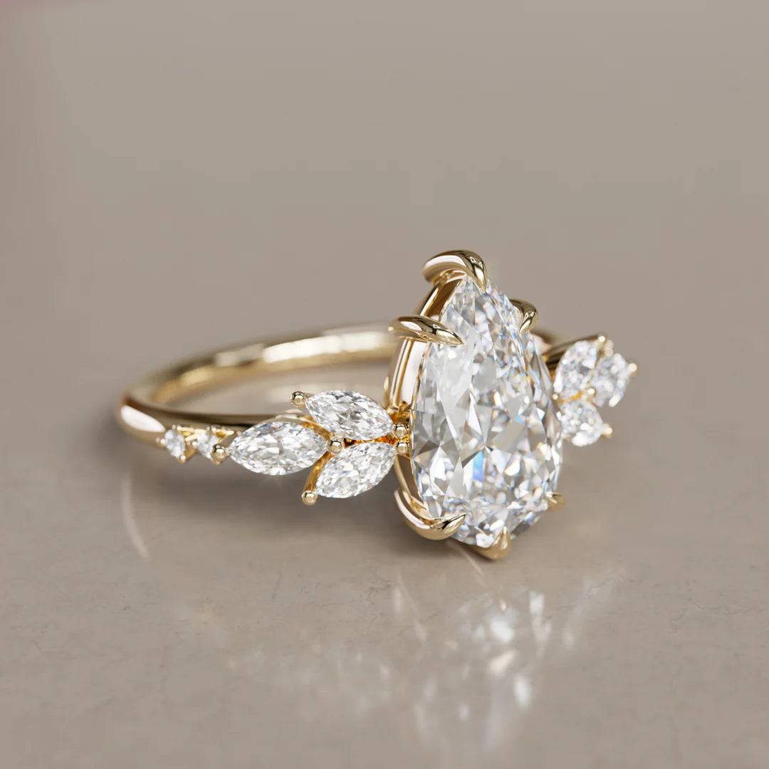 Pear Cut Engagement Ring With Marquise And Round Side Diamonds
